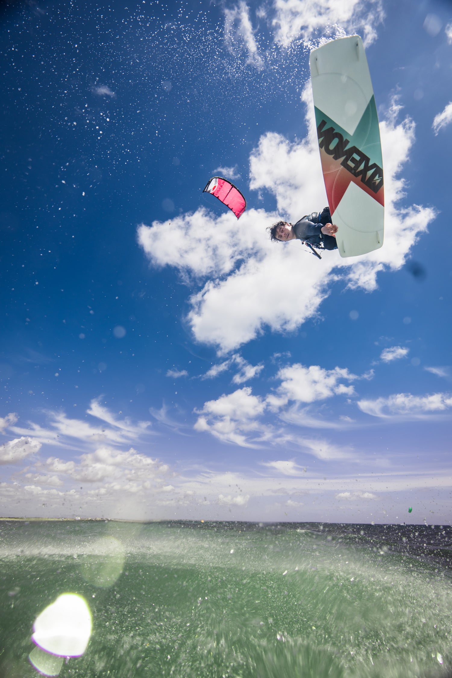 Action picture of the Xenon Boards Laluz 2024 twintip kiteboard board.