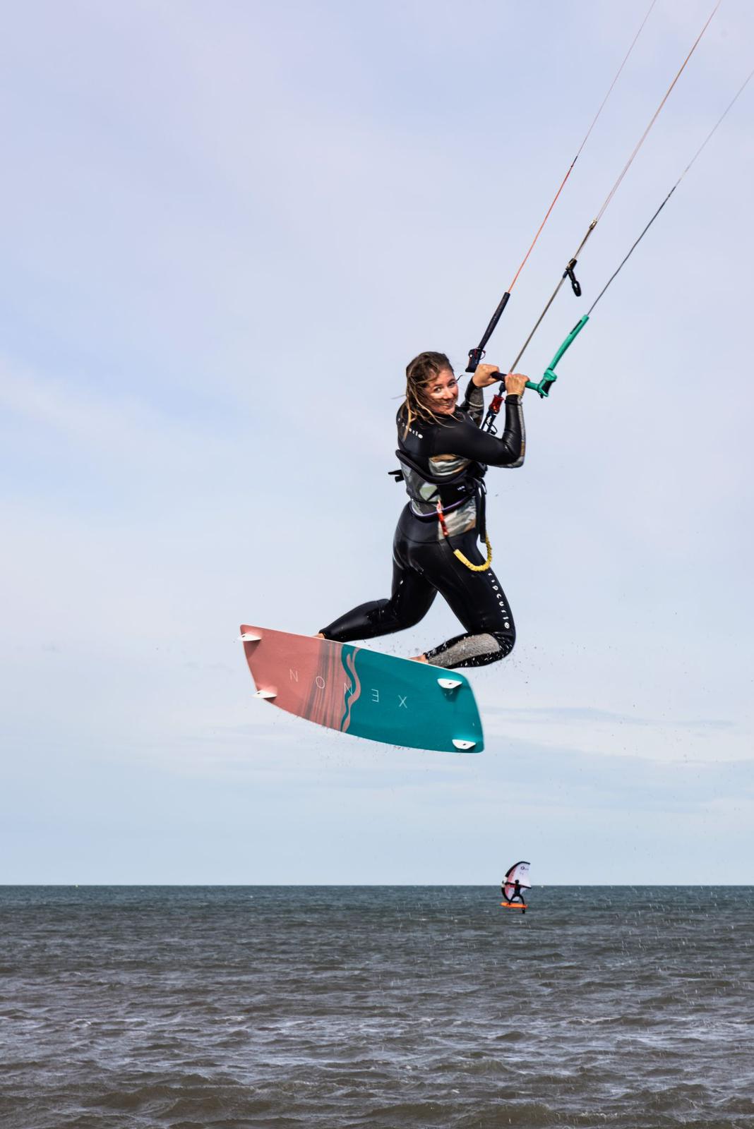 Action picture of the Xenon Boards Women 2024 twintip kiteboard board.